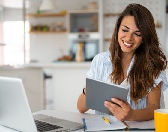 Younger white woman at computer